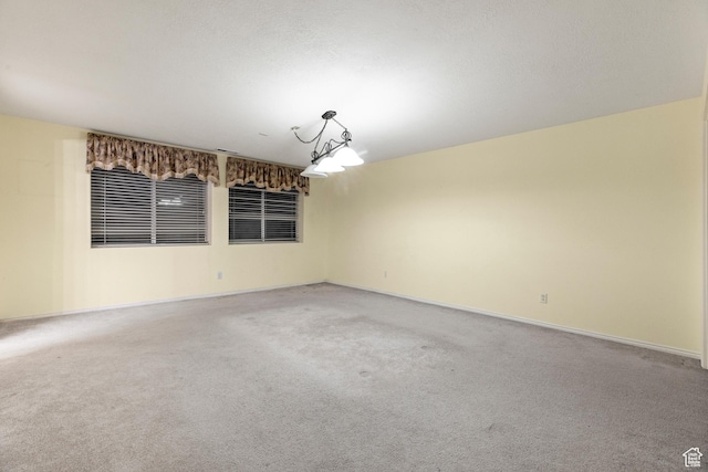 unfurnished room featuring carpet floors