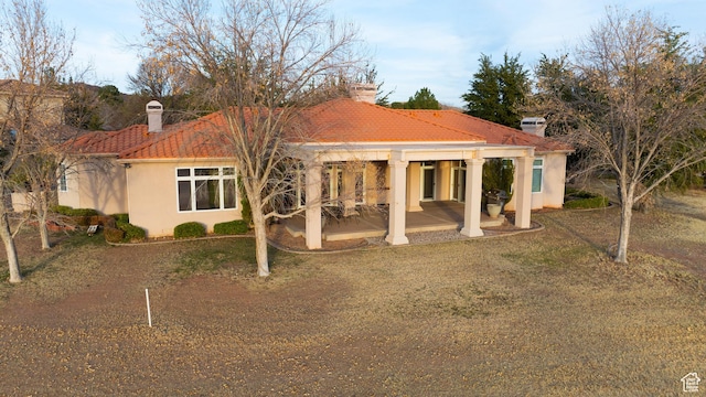 back of house with a patio area