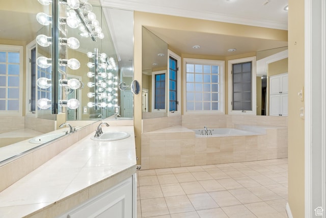 bathroom with tile patterned flooring, vanity, tiled bath, and ornamental molding