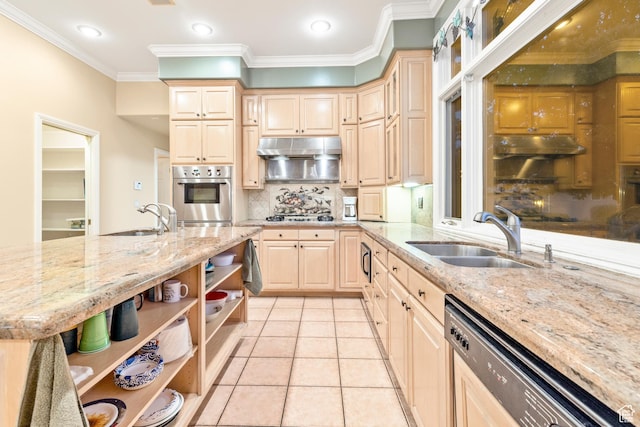kitchen with sink, light stone countertops, stainless steel appliances, and light brown cabinetry