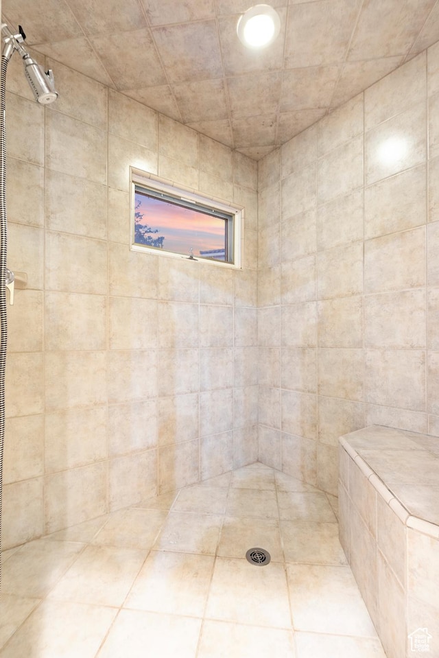 bathroom with tiled shower