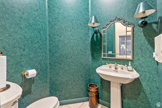 bathroom featuring tile patterned floors, sink, and toilet