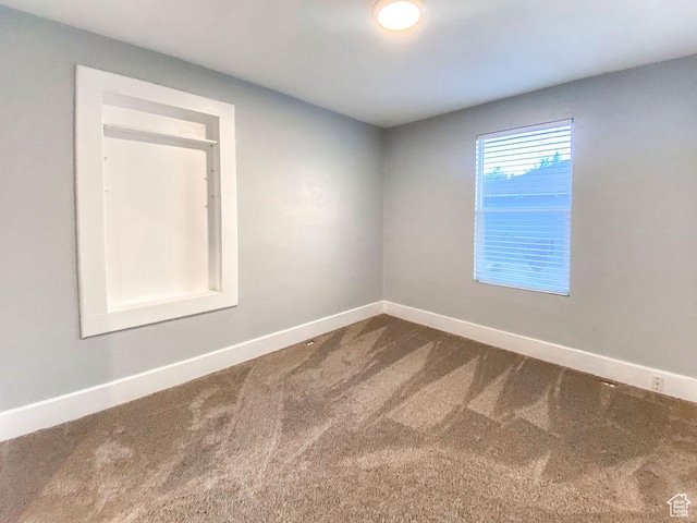 unfurnished room with carpet flooring