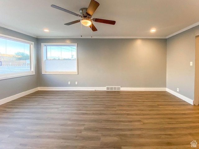 unfurnished room with hardwood / wood-style floors, ornamental molding, and ceiling fan