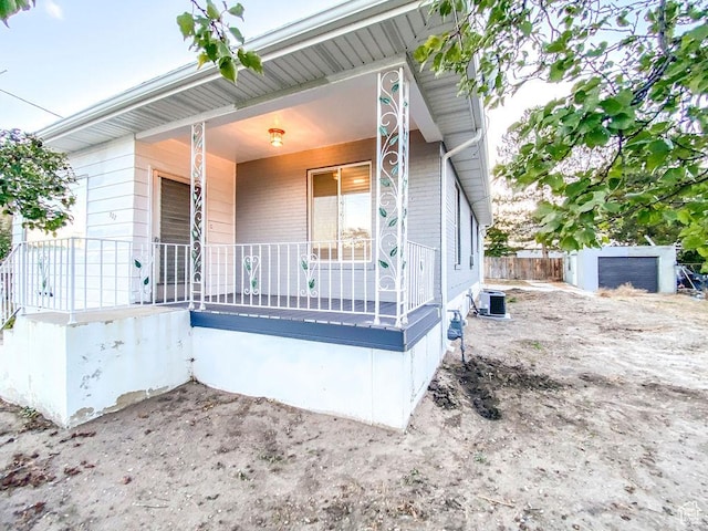 view of front of property with a porch and central air condition unit