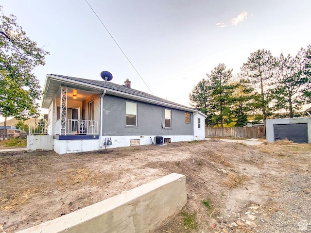 view of property exterior featuring a porch and cooling unit