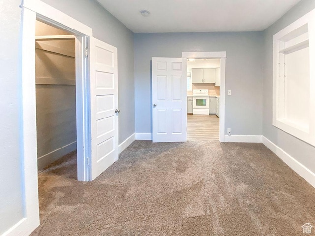 unfurnished bedroom with carpet