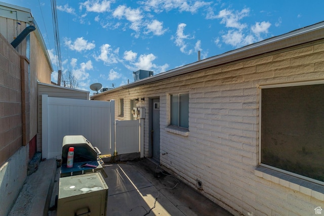 view of side of home featuring a patio