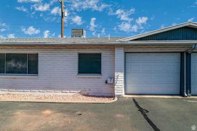 ranch-style home featuring a garage