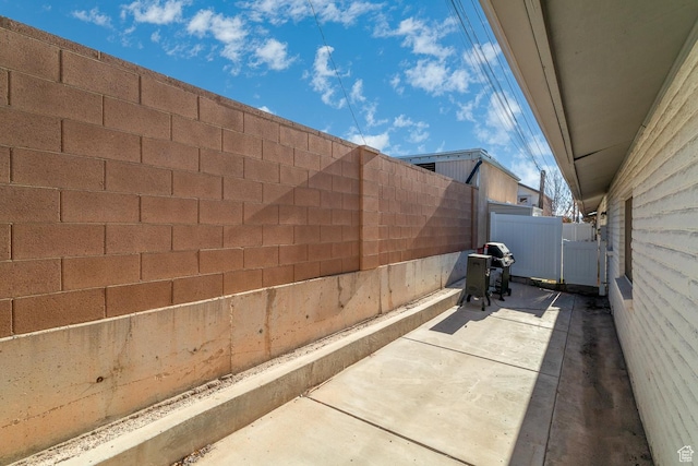 view of side of property with a patio