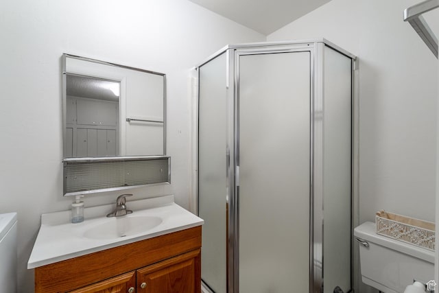 bathroom with vanity, toilet, and walk in shower