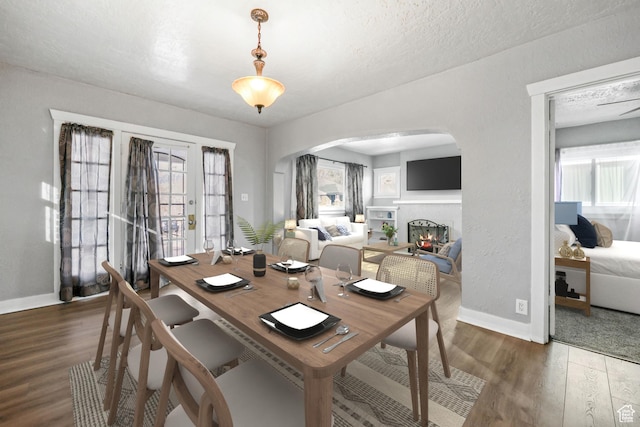 845 Binford St, Ogden, UT 84401 - dining space with dark hardwood / wood-style flooring, a textured ceiling, a wealth of natural light, and french doors