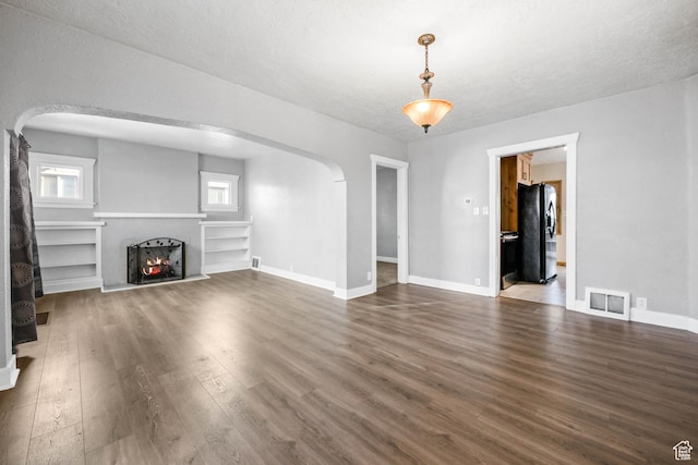 845 Binford St, Ogden, UT 84401 - unfurnished living room with a textured ceiling and hardwood / wood-style flooring