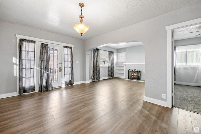 845 Binford St, Ogden, UT 84401 - unfurnished living room featuring a textured ceiling and dark hardwood / wood-style floors