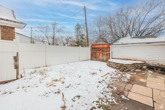 845 Binford St, Ogden, UT 84401 - snowy yard featuring a storage shed