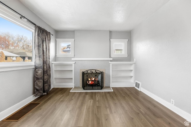 845 Binford St, Ogden, UT 84401 - unfurnished living room featuring hardwood / wood-style flooring and a textured ceiling