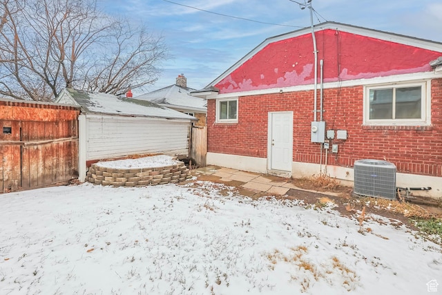 845 Binford St, Ogden, UT 84401 - snow covered rear of property featuring central AC