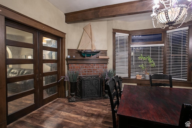 121 T St, Salt Lake City, UT 84103 - dining space featuring beamed ceiling, a brick fireplace, a chandelier, and dark wood-style floors