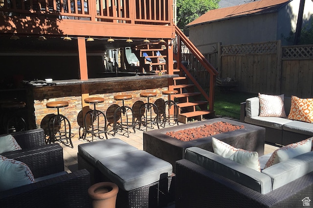 121 T St, Salt Lake City, UT 84103 - view of patio / terrace with a ceiling fan, outdoor dry bar, stairs, fence, and an outdoor living space with a fire pit