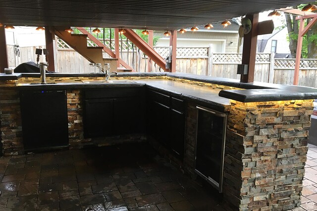 121 T St, Salt Lake City, UT 84103 - view of patio / terrace with exterior kitchen, stairway, a sink, and fence