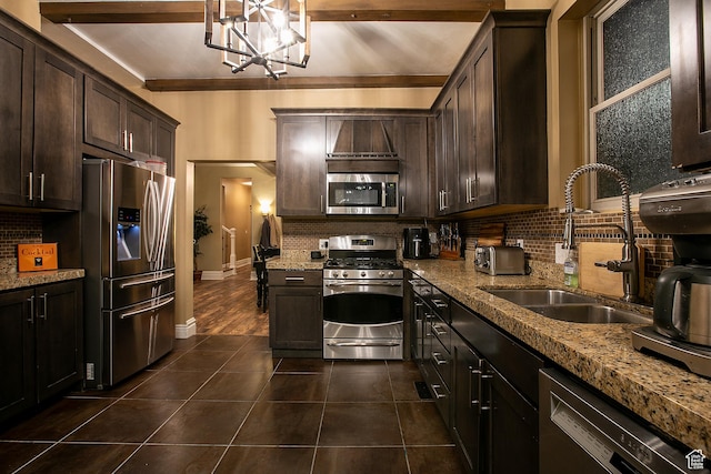 121 T St, Salt Lake City, UT 84103 - kitchen with stainless steel appliances, dark tile patterned flooring, a sink, and tasteful backsplash