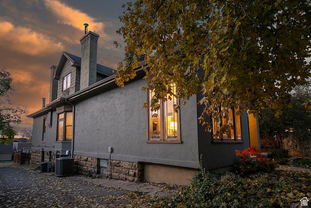 121 T St, Salt Lake City, UT 84103 - view of property exterior featuring a chimney, fence, and cooling unit