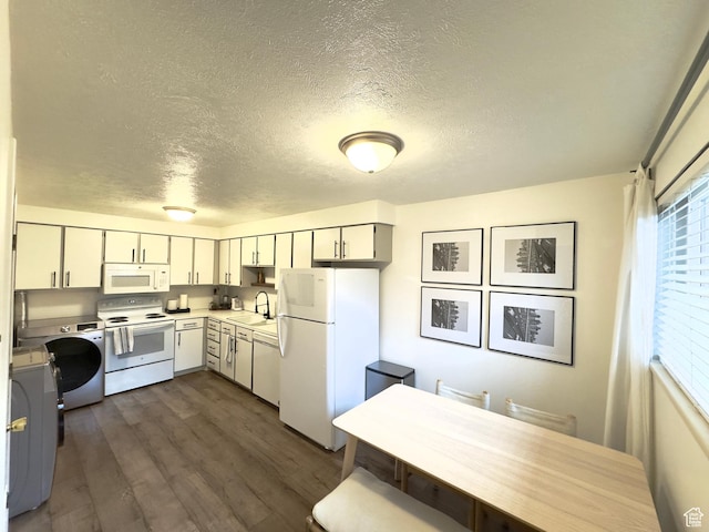 314 W Center St Unit D 141, Bountiful, UT 84010 - kitchen with a textured ceiling, white appliances, washer / clothes dryer, sink, and dark hardwood / wood-style floors