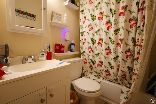 full bathroom featuring shower / bath combo, vanity, and toilet