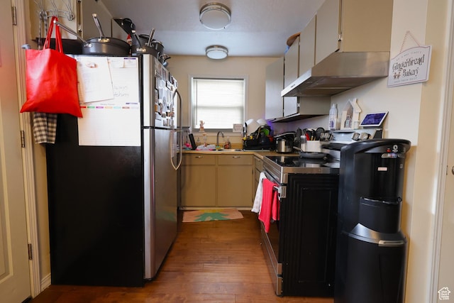 kitchen with extractor fan, dark wood-type flooring, sink, range, and stainless steel refrigerator