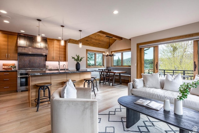 45 King Rd, Park City, UT 84060 - living room featuring recessed lighting, light wood-style floors, vaulted ceiling, and a healthy amount of sunlight
