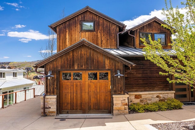 45 King Rd, Park City, UT 84060 - view of front of property with a garage, a standing seam roof, and metal roof