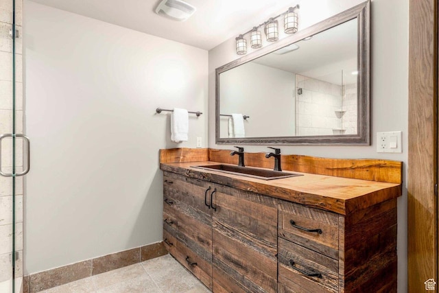 45 King Rd, Park City, UT 84060 - bathroom with visible vents, baseboards, vanity, tile patterned floors, and a stall shower