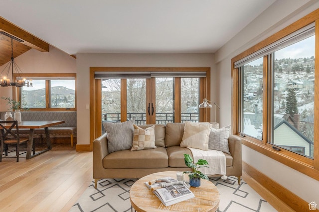 45 King Rd, Park City, UT 84060 - living area featuring a wealth of natural light, light wood-type flooring, beamed ceiling, and a chandelier