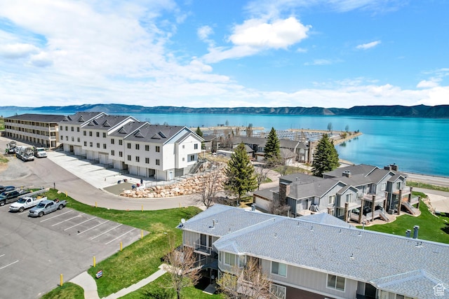 aerial perspective of suburban area featuring a large body of water