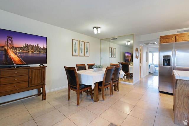 dining room featuring light tile patterned flooring