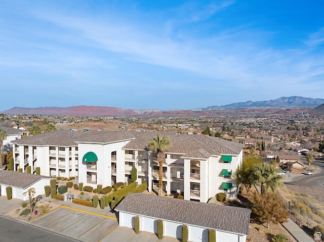 birds eye view of property featuring a mountain view