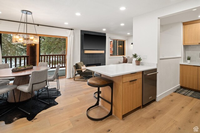 401 Silver King Dr, Park City, UT 84060 - kitchen featuring a chandelier, light wood-style flooring, recessed lighting, a peninsula, and dishwasher