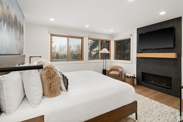 401 Silver King Dr, Park City, UT 84060 - bedroom featuring a fireplace and hardwood / wood-style flooring