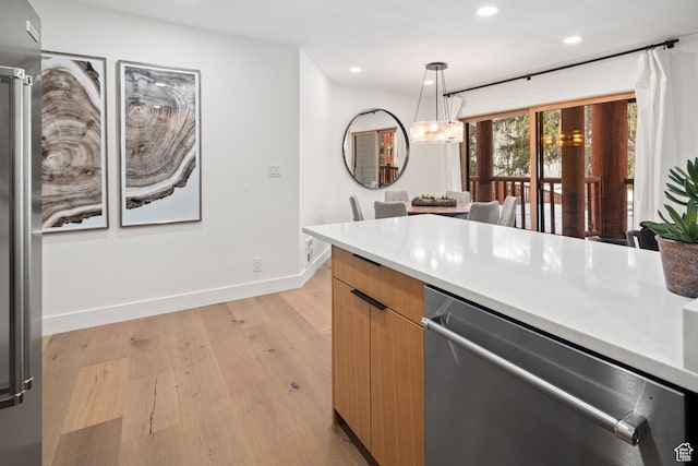 401 Silver King Dr, Park City, UT 84060 - kitchen with stainless steel dishwasher, modern cabinets, light wood-type flooring, recessed lighting, and hanging light fixtures
