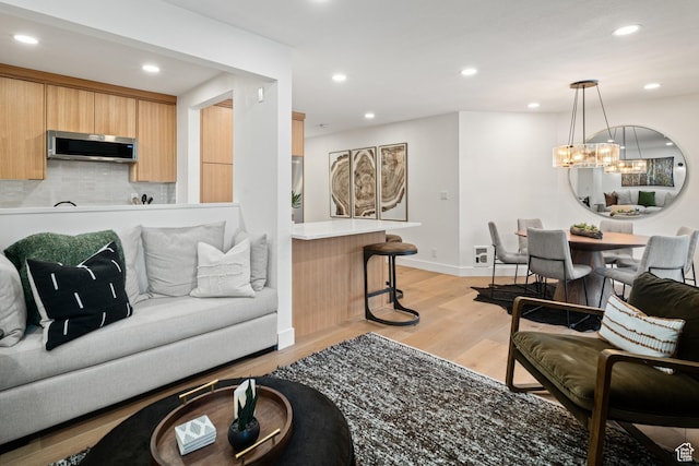 401 Silver King Dr, Park City, UT 84060 - living room with light hardwood / wood-style floors and a notable chandelier