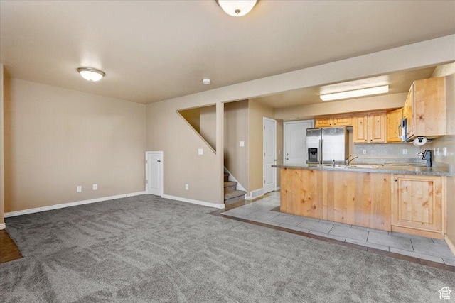 419 E 475 N, Ogden, UT 84404 - kitchen featuring light carpet, sink, stainless steel fridge with ice dispenser, light brown cabinetry, and kitchen peninsula