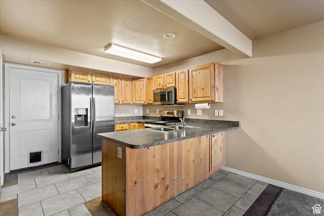 419 E 475 N, Ogden, UT 84404 - kitchen with sink, light tile patterned floors, light brown cabinetry, kitchen peninsula, and stainless steel appliances
