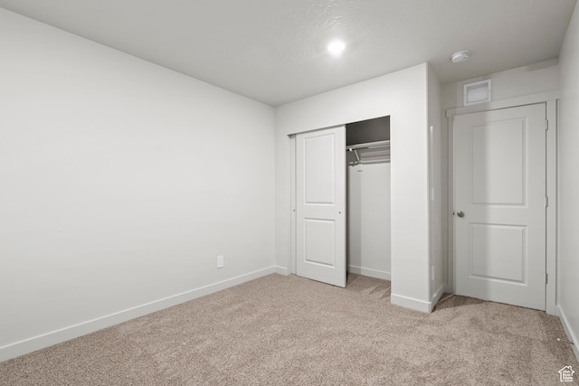 3474 S 3100 W Unit 146, West Haven, UT 84401 - unfurnished bedroom with baseboards, light colored carpet, visible vents, and a closet