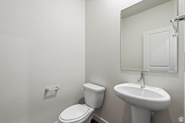 3474 S 3100 W Unit 146, West Haven, UT 84401 - half bathroom featuring baseboards, a sink, and toilet