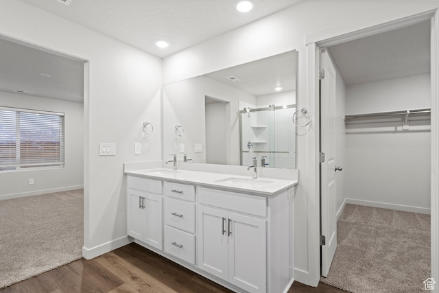 3474 S 3100 W Unit 146, West Haven, UT 84401 - bathroom featuring double vanity, a sink, a walk in closet, and a stall shower