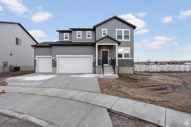 3474 S 3100 W Unit 146, West Haven, UT 84401 - view of front of house featuring central AC, driveway, and a garage