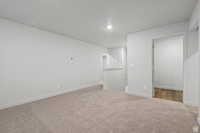 3474 S 3100 W Unit 146, West Haven, UT 84401 - unfurnished bedroom featuring baseboards, a walk in closet, and carpet