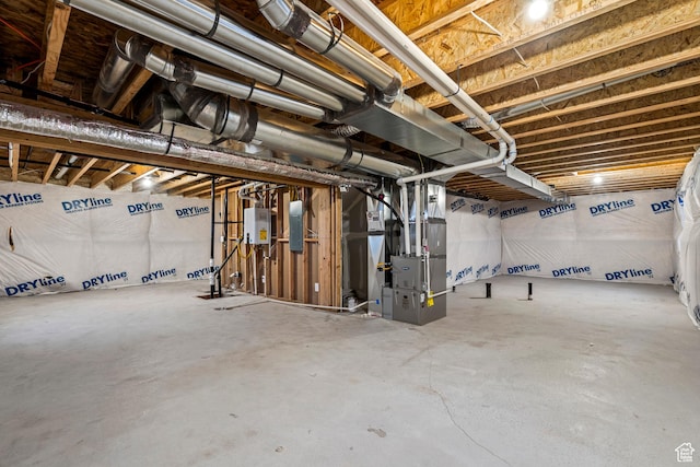 3474 S 3100 W Unit 146, West Haven, UT 84401 - unfinished below grade area with heating unit, water heater, and electric panel