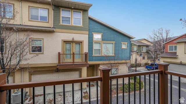 1026 N Shepard Creek Pkwy Unit 4, Farmington, UT 84025 - back of property featuring a garage and central AC unit