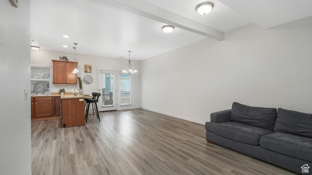 1026 N Shepard Creek Pkwy Unit 4, Farmington, UT 84025 - living room featuring light hardwood / wood-style flooring, beamed ceiling, and a notable chandelier
